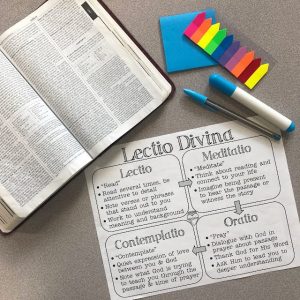 A photo of a bible and a guide to Lectio Divina